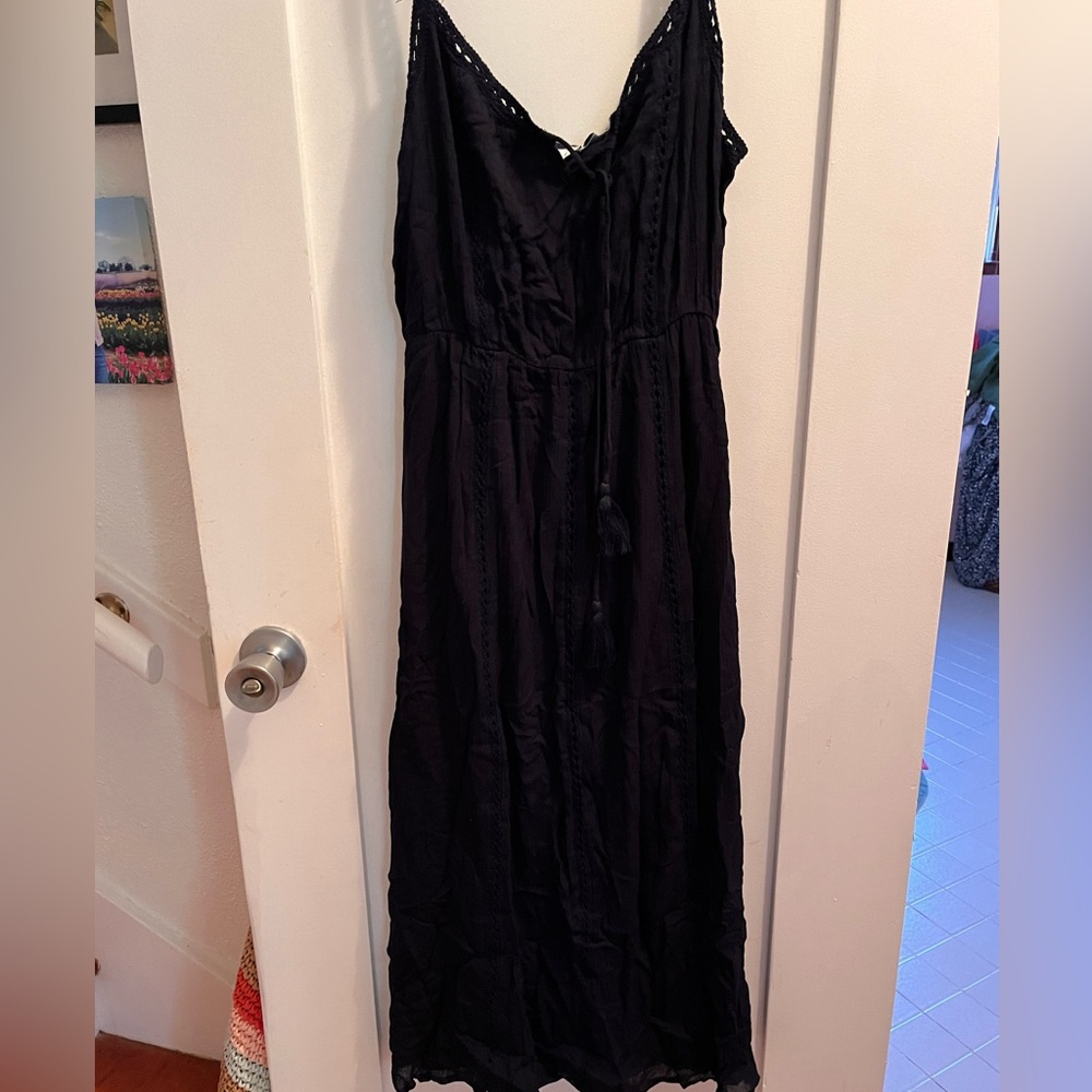Lush midi dress with nice details around chest/neck. Size large.